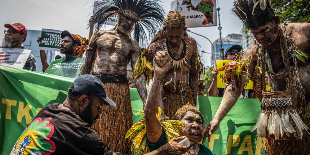 Papuan Indigenous people and activists from coalition Merauke Solidarity hold a protest in front of the Defense Ministry office in Jakarta. The coalition is demanding the President, Defense Minister, Agricultural Minister, and Ministry of Investment / Indonesia Investment Coordinating Board (BKPM) to stop the Food Estate Strategic National Project (PSN) Merauke that will destroy million hectares of Papuan forests into Sugar cane plantation, bioethanol, and rice paddies.